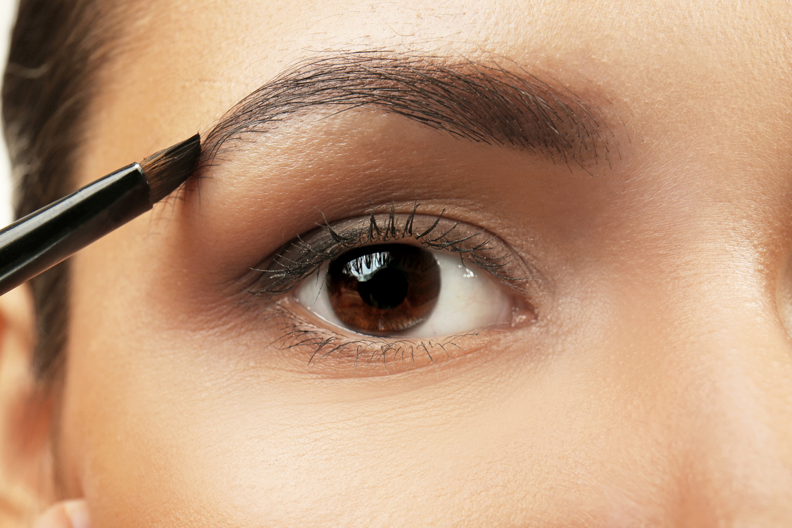 Woman Applying Eyebrow Makeup